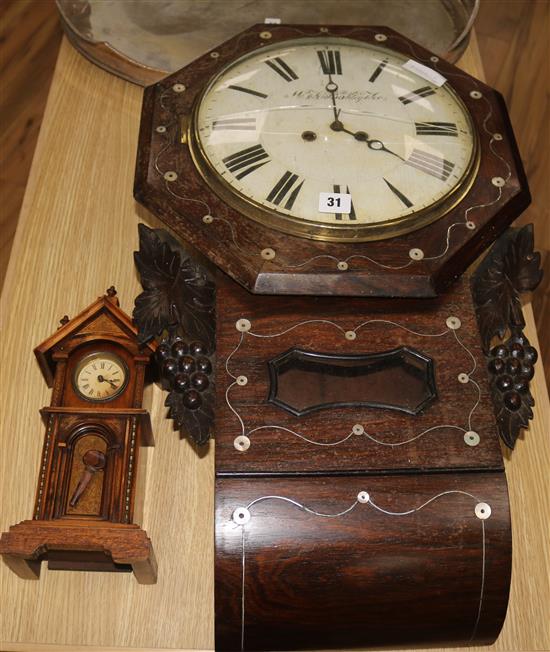 A Black Forest wall clock and a German miniature grandfather timepiece